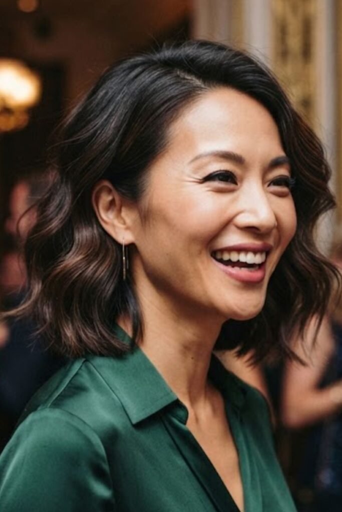 Woman with a bob styled in soft glamorous waves
