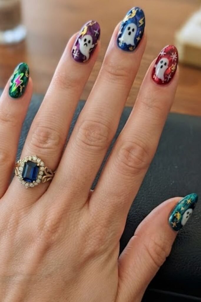 Jewel tone marble nails with gold foil veining