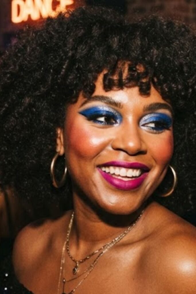 Woman wearing a full glam 80s power makeup look