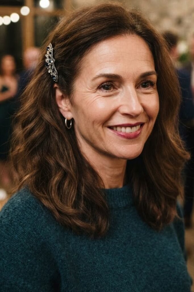 Medium hair pinned back on one side with a jeweled clip