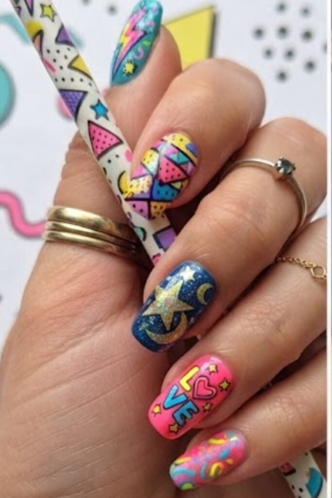 Gold stars and moons on deep purple and blue nails