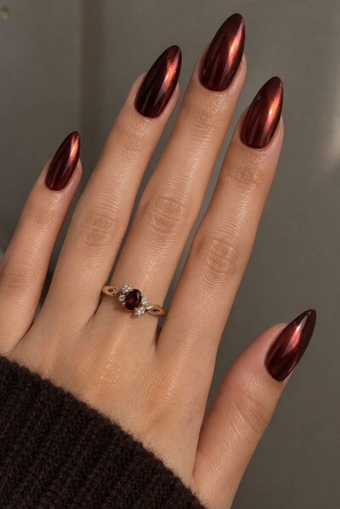 Cherry mocha nails with a chrome glaze