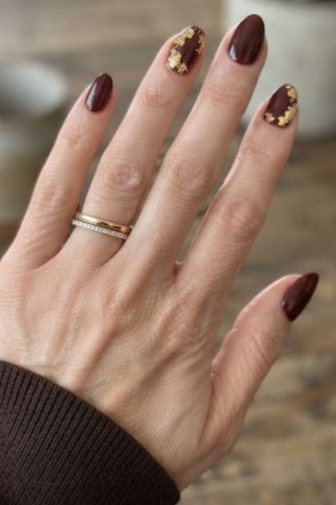 Cherry mocha nails with gold foil accents