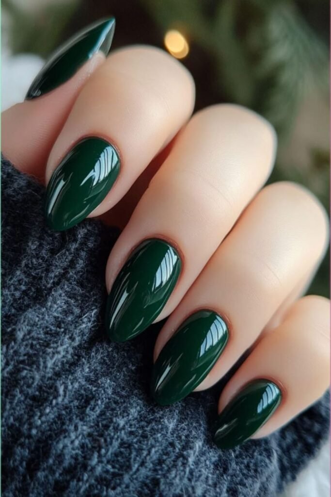 Glossy forest green manicure on short oval nails