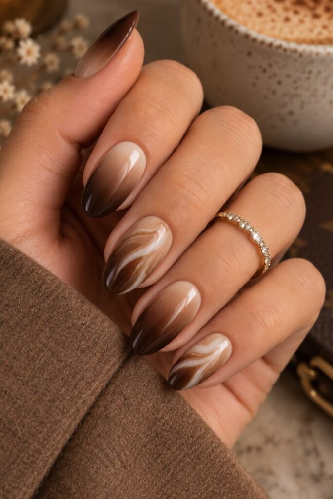 Espresso ombre nails with milky swirl accents