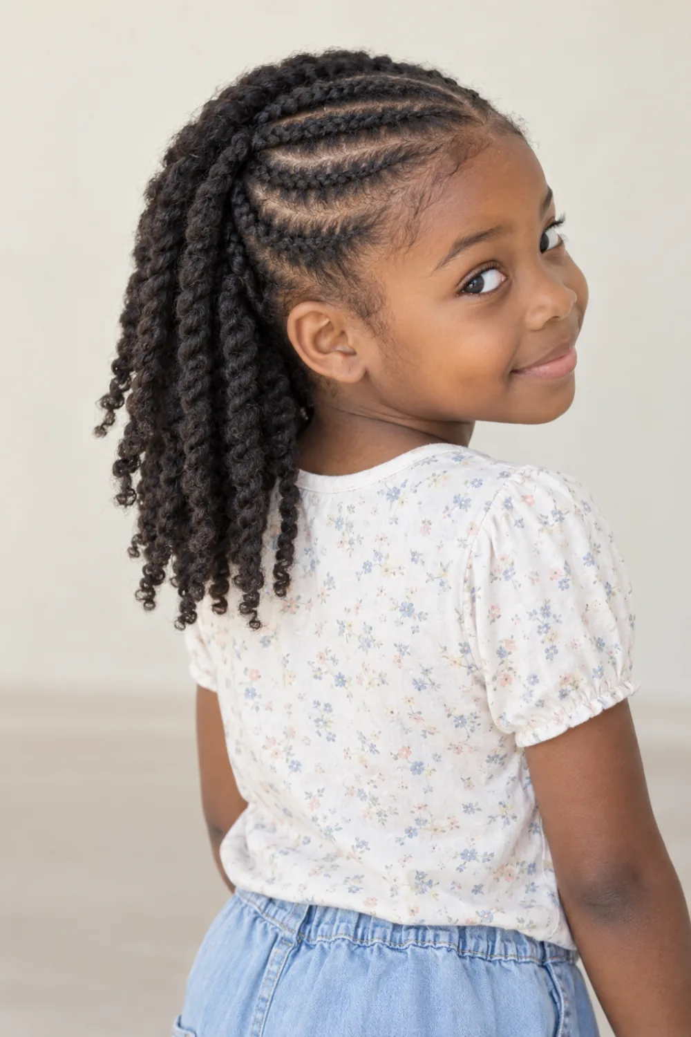 Front cornrows with loose two-strand twists at the back