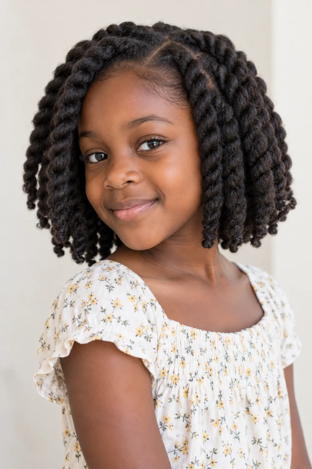 Chunky natural two-strand twists shaped into a short bob