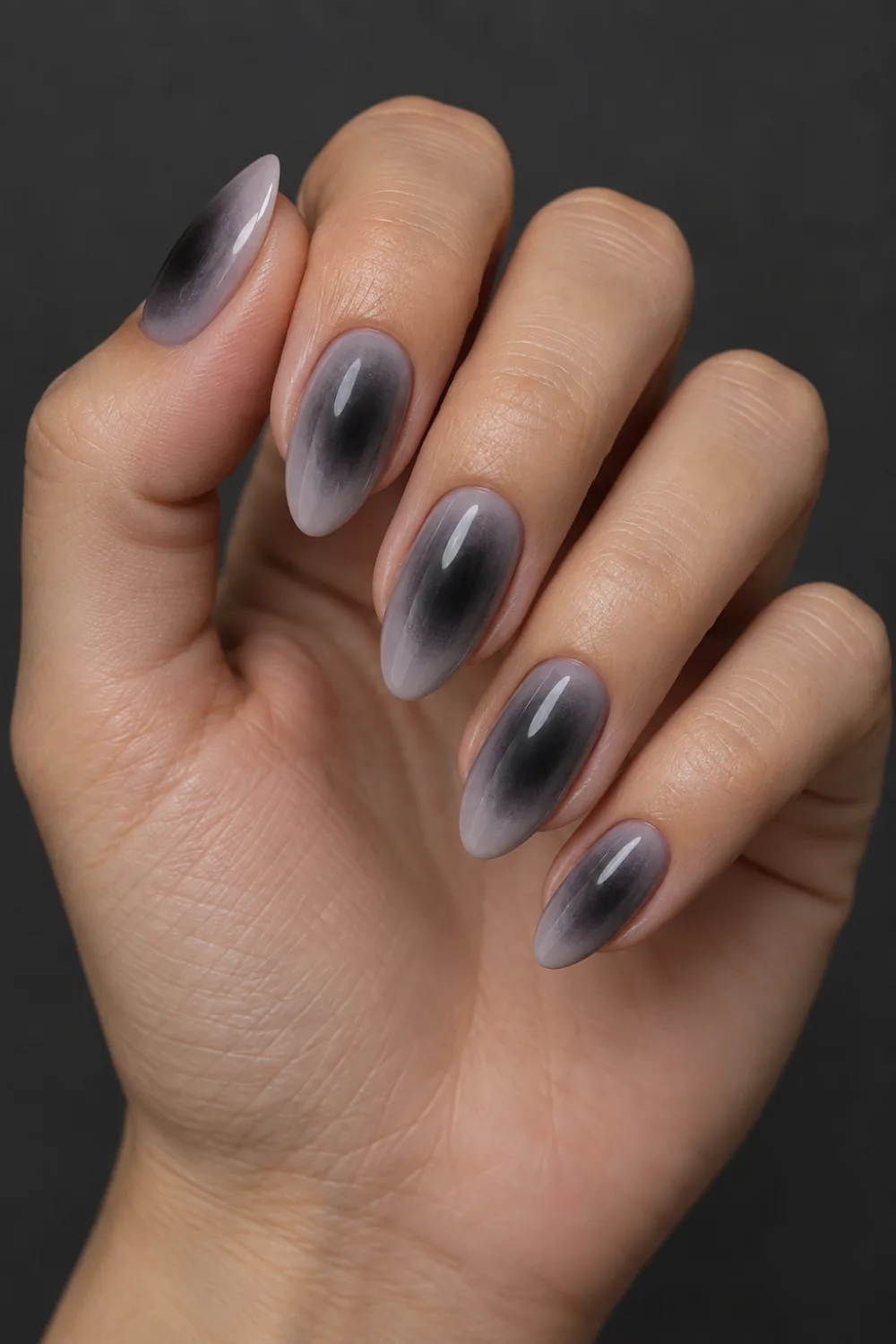 Muted lavender-gray nails with smoky charcoal aura centers
