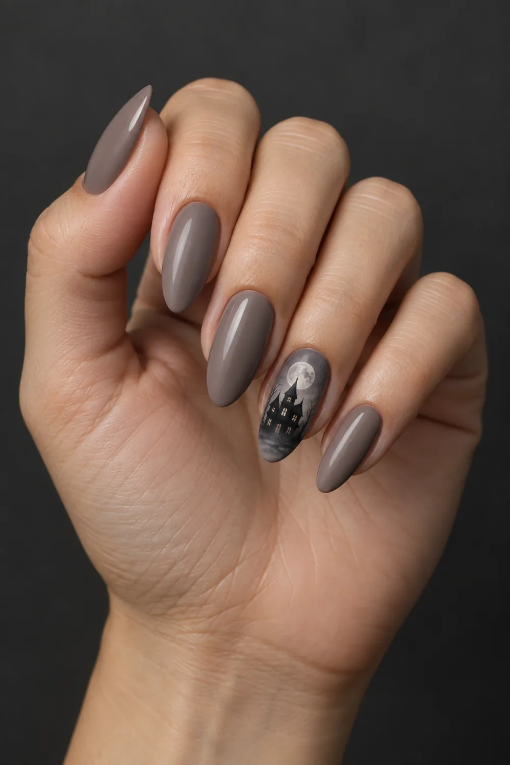 Taupe nails with one haunted-house silhouette beneath a moon