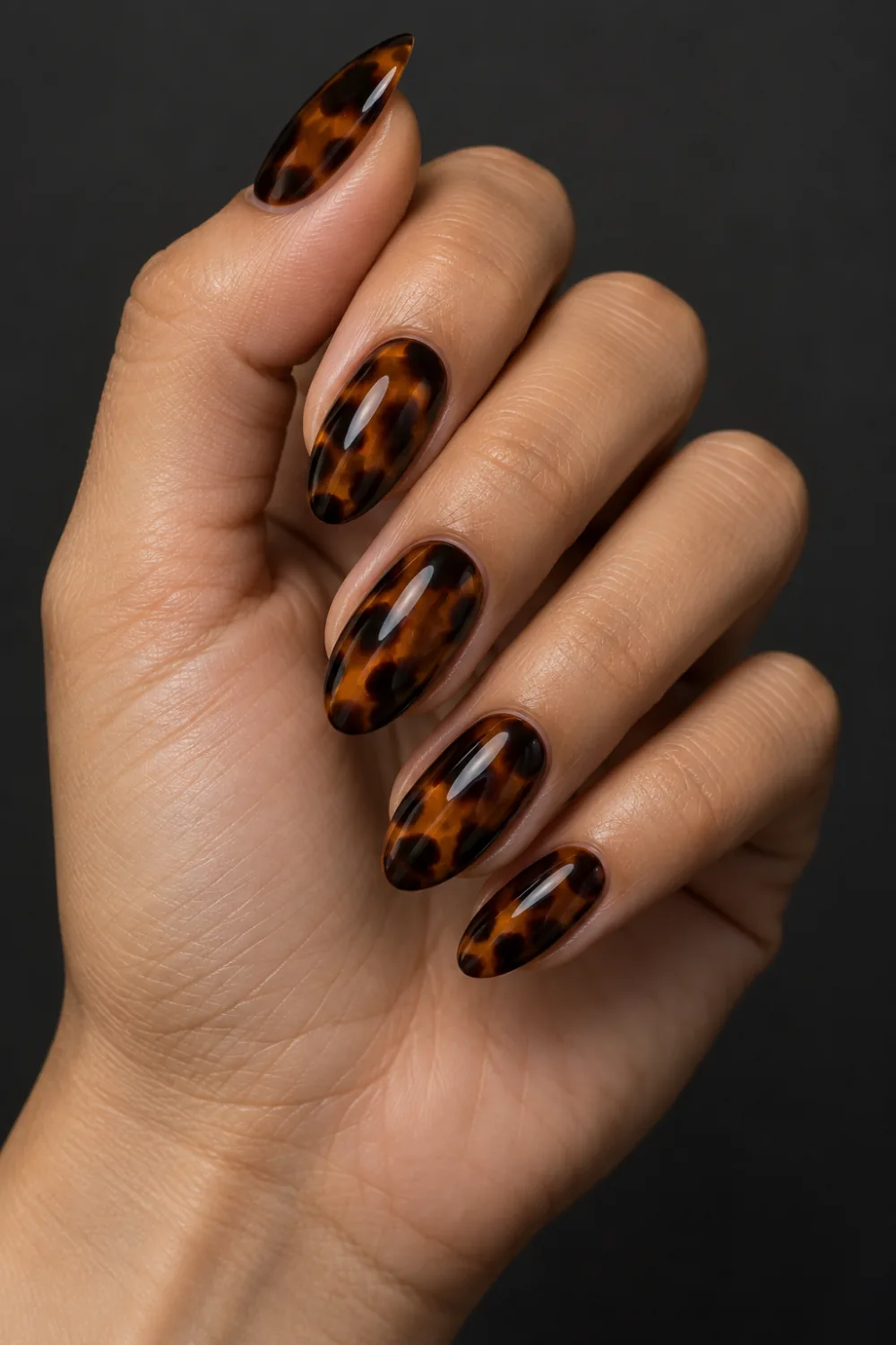 Dark espresso and amber tortoiseshell almond nails