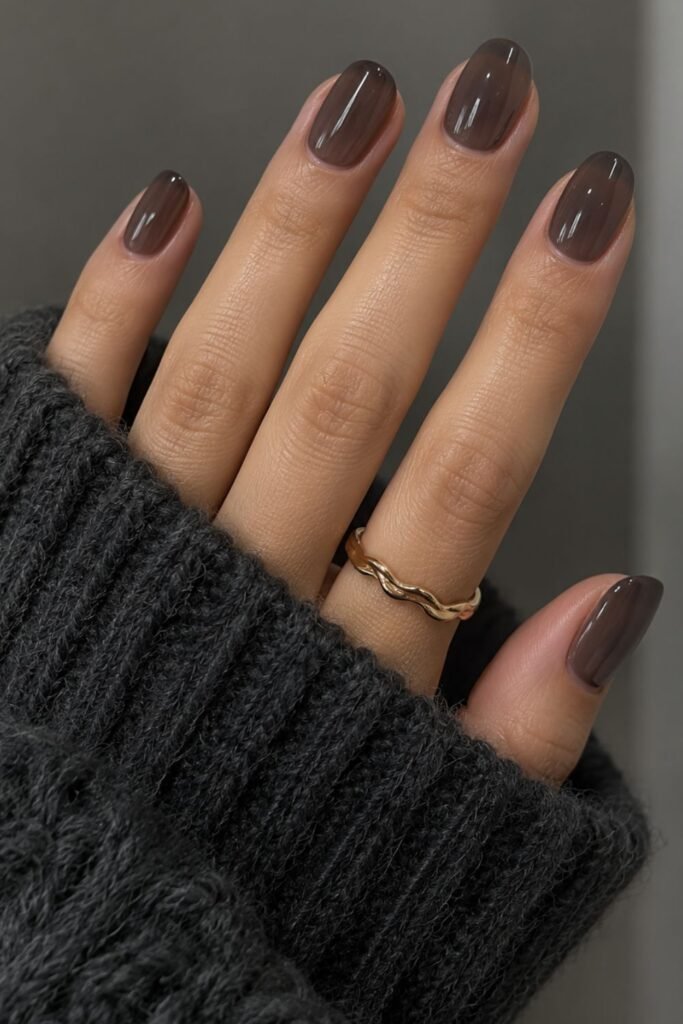 Short nails with sheer charcoal glass gel polish